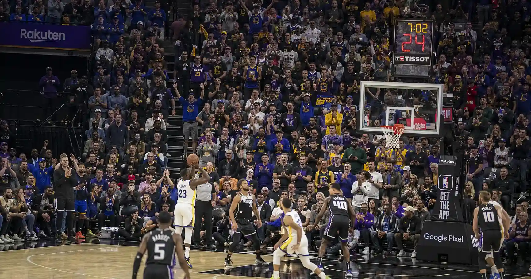 Crowded NBA arena with fans watching basketball game